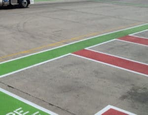 red and green paint outlining designated parking spaces